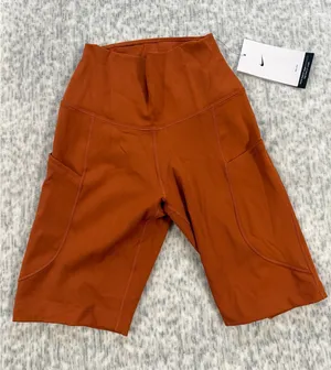 Nike One Dri-FIT Womens High Rise 8 Inch Biker Shorts Burnt Orange FZ6758-825 XS thumbnail 1