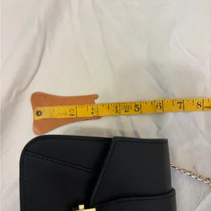 Elegant Black Leather Bag with Gold Accents thumbnail 13