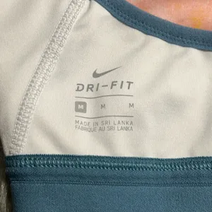 Nike Dri-FIT INDY ARTIST FEMME Blue and White Sport Bra Size Medium thumbnail 6