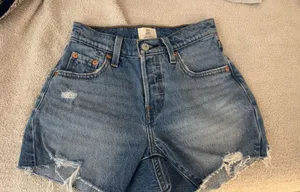 Levi's jean shorts. never worn bought to small. size 23 thumbnail 1