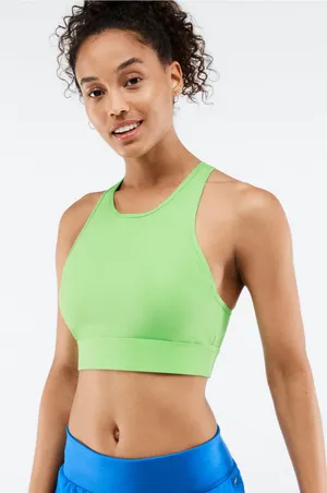 Fabletics Siena High Impact Sports Bra in Green XS Product Description Your favorite high-support sports bra is now updated with a higher neck and wider bottom band for even more coverage. It's also built with perforated details for supreme cooling capabilities. Features 4-Way Stretch Fabric Knit 81% Nylon/19% Elastane Imported by Fabletics GmbH, Bergmannstraße 102/103, 10961 Berlin thumbnail 1