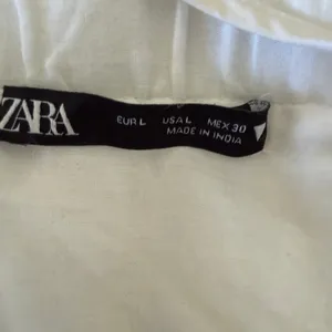 ZARA | White Eyelet Puff Sleeve Lace Up Back Mini Dress | Large thumbnail 7