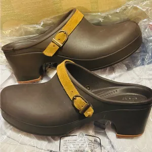 Crocs Sarah clogs in a brown color with a tan suede leather strap thumbnail 1