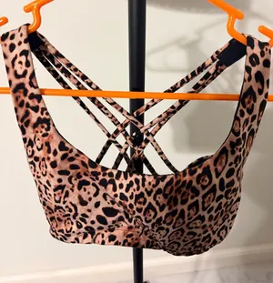 PINK Victoria's Secret Leopard-Print Strappy Sports Bra in Brown and Black thumbnail 1