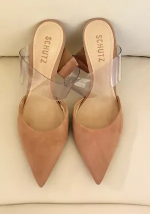 Sionne Clear Strap Pointed Toe Mule from the luxury footwear brand Schutz. Its avant-garde design combines classic elegance with modern details. Size 7 thumbnail 1