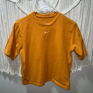 Nike Orange Cropped Short-Sleeve Tee with White Swoosh thumbnail 1