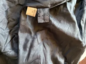 Vintage Black leather Rock Creek trench coat size small The outer shell is 100% genuine leather The lining in Nylon! Missing 1 button on the right side in pictures 1-4 not noticeable or even a snag there!!! thumbnail 5