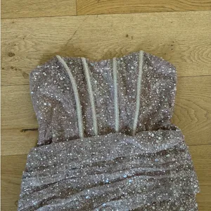 Lulu’s - Vivacious Lace Up Strapless Sparkly Mini Dress in Champagne thumbnail 2