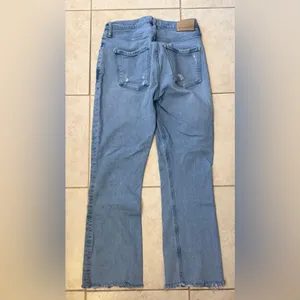 Citizens of Humanity Isola cropped bootcut jeans in a distressed light wash. thumbnail 2