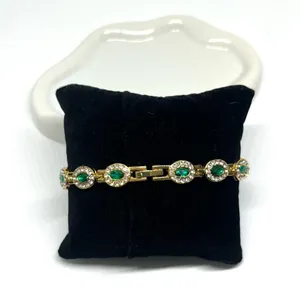 Luxury women’s watch sparkly emerald green stone thumbnail 3