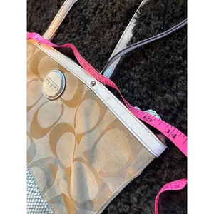 Signature coach bag with accent thumbnail 14