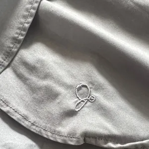Jaanuu Peplum scrub top thumbnail 4