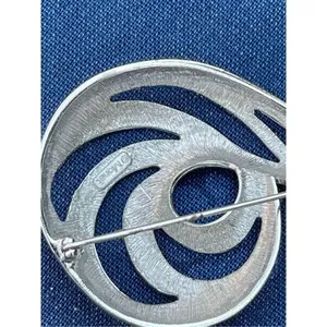 Vintage shiny Monet swirl brooch. Large thumbnail 6