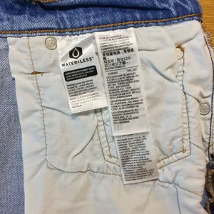 Levi’s 501 Jean shorts 26 button-fly medium wash distressed thumbnail 6