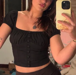 NAANAA | BLACK PUFF-SLEEVE BUTTON CROP TOP NWT thumbnail 1