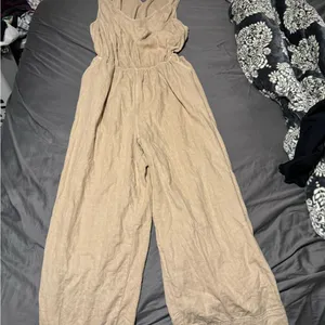 Universal Threads Tan Jumpsuit with Relaxed Fit and Sleeveless Design thumbnail 1