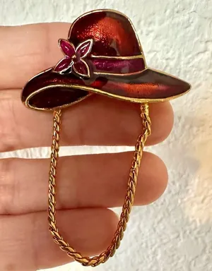 Red enamel hat brooch with gold tone chain thumbnail 1