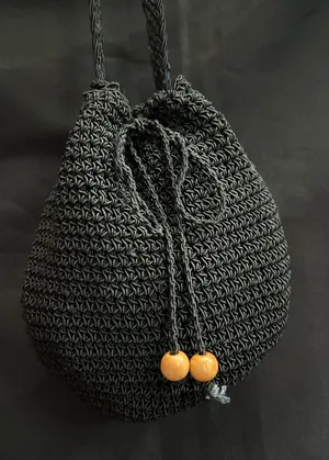 Black Crochet Drawstring Crossbody Bag thumbnail 1