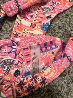 &merci Vibrant floral bikini set perfect for summer. Features a mix of red, pink, and blue hues for a standout look at the beach or pool. thumbnail 7