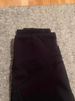 Black stretchy Yvette leggings with mesh design on outer thighs and ankles #activewear No flaws The lighting makes it look a little brown but they are plain black leggings I am a 26 in waist and 5'6" for reference thumbnail 5