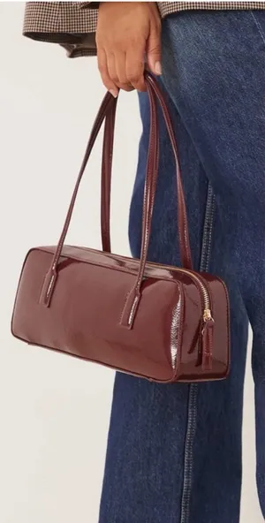 ASOS- burgundy patent faux leather elongated shoulder bag thumbnail 1