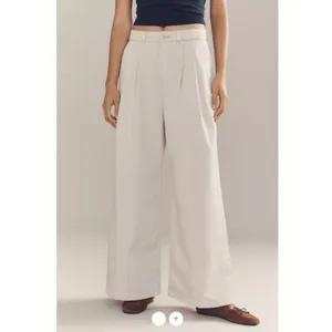 By Anthropologie Low-Rise Pleated Wide-Leg Trousers thumbnail 3