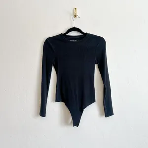 Abercrombie & Fitch | Soft A&F Ribbed Long Sleeve Thong Bodysuit in Black thumbnail 2
