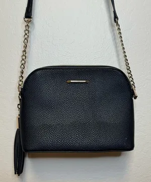 Black cross-body purse with gold detailing thumbnail 1