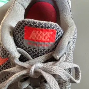 Nike revolution 3 Sneakers in Gray with Bright Orange Accents women’s size 7.5 thumbnail 5