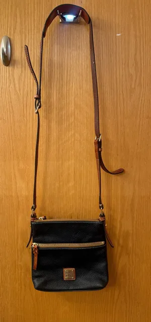 This is a Dooney & Bourke black pebbled leather crossbody thumbnail 1