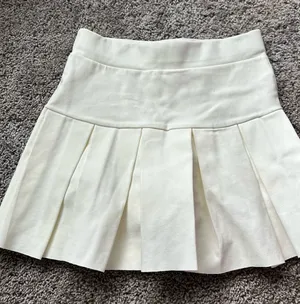 Dolls Kill Cream Pleated Mini Skirt thumbnail 1