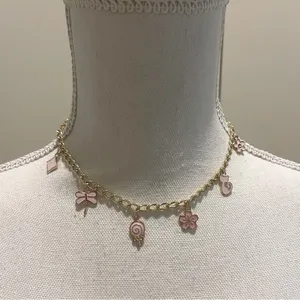 Pink and gold charm choker necklace thumbnail 1