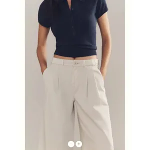 By Anthropologie Low-Rise Pleated Wide-Leg Trousers thumbnail 5