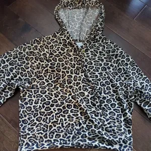 Crop style hoodie size medium in leopard print with wide sleeves by love… thumbnail 1