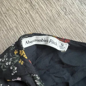 Abercrombie & Fitch black midi wrap dress floral orange and yellow floral size M thumbnail 11