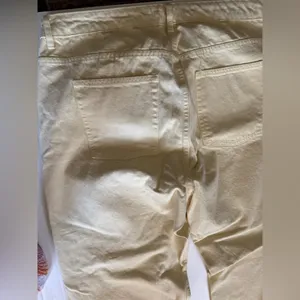 Primark women’s jeans, high waisted wide leg yellow, ankle vents yellow denim 16 thumbnail 5
