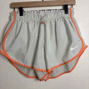 Nike Dri‎ Fit Running Shorts Women Light Gray Orange Trim Athletic Gym Size L thumbnail 1