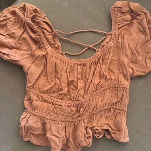 Lush Clothing Boutique Orange Ruffle Tie Back Top thumbnail 1