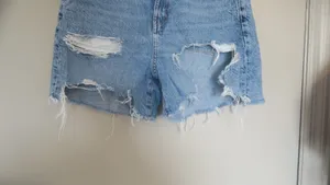 American Eagle Outfitters baggy mom short shorts ripped in light wash blue size 4. thumbnail 3