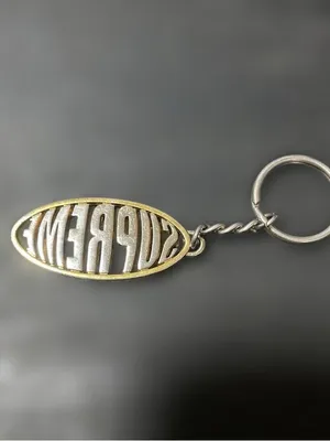 Supreme Two-Tone Oval Logo Keychain — Silver & Gold thumbnail 2