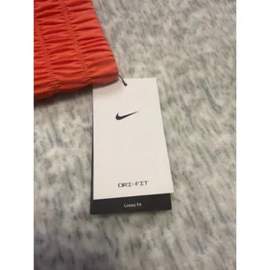 Nike Dri Fit Loose Fit Womens Training Running Shorts XS Coral‎ NWT thumbnail 2
