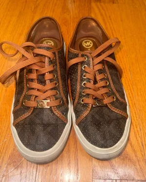 Michael Kors Brown and Tan women’s Fashion Sneakers thumbnail 1
