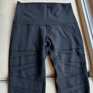 Lululemon Black Leggings with criss cross sheer panels down front of leg size 6 thumbnail 1