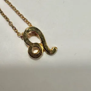 Leo zodiac sign gold tone pendant necklace thumbnail 5