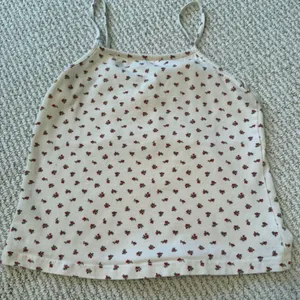 Brandy Melville Cream Tank Top with Red Floral Pattern thumbnail 2