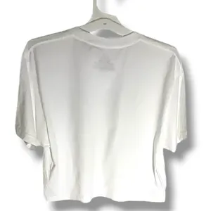 NWOT Monet Art Crop T Shirt White Graphic Tee The Beach Falaise d’Amont This NWOT Monet Art Crop T Shirt in white features a graphic design inspired by The Beach Falaise d’Amont 1889, making it a stylish and artistic addition to any woman's wardrobe. Made from 100% cotton, this regular fit tee has a crew neckline and a cropped style for a modern and trendy look. Perfect for art enthusiasts or those looking to add a unique touch to their outfit, this T-shirt is comfortable and versatile, ideal for everyday wear. thumbnail 11