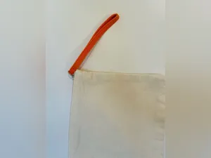 Origins Natural Canvas Wristlet with Orange Strap and Black Logo thumbnail 5