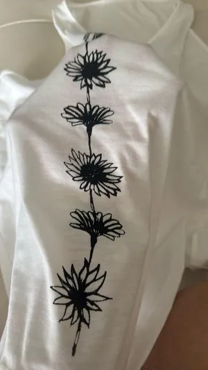 White Sleeveless Top with Black Floral Design thumbnail 2