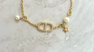 Christian Dior Crystal & Resin Pearl Petit CD Charm Gold Bracelet thumbnail 2