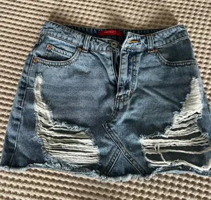 Mystique Boutique Distressed Light Blue Denim Mini Skirt thumbnail 1